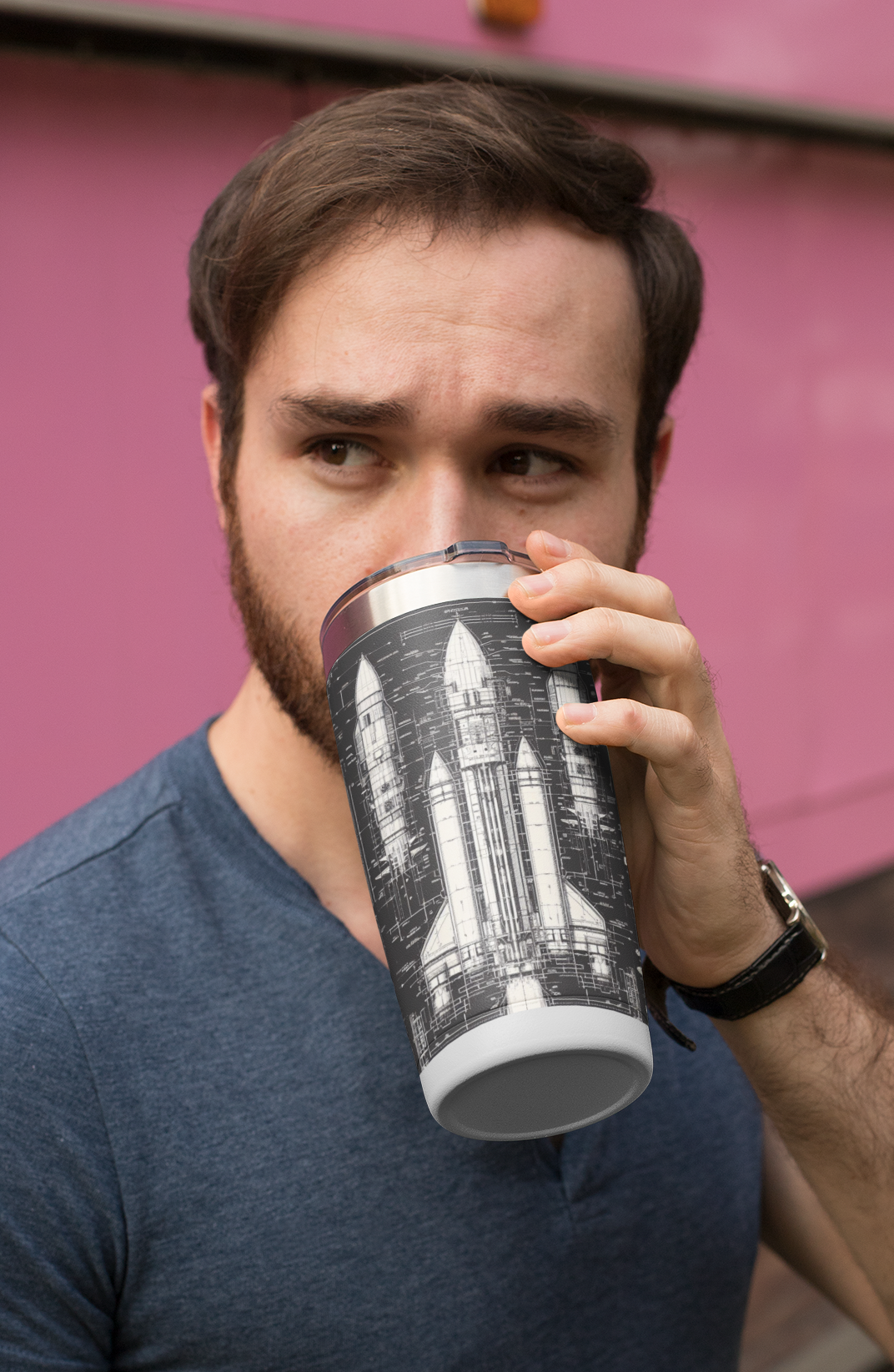 A man drinking from his Dark Rocket Tumbler